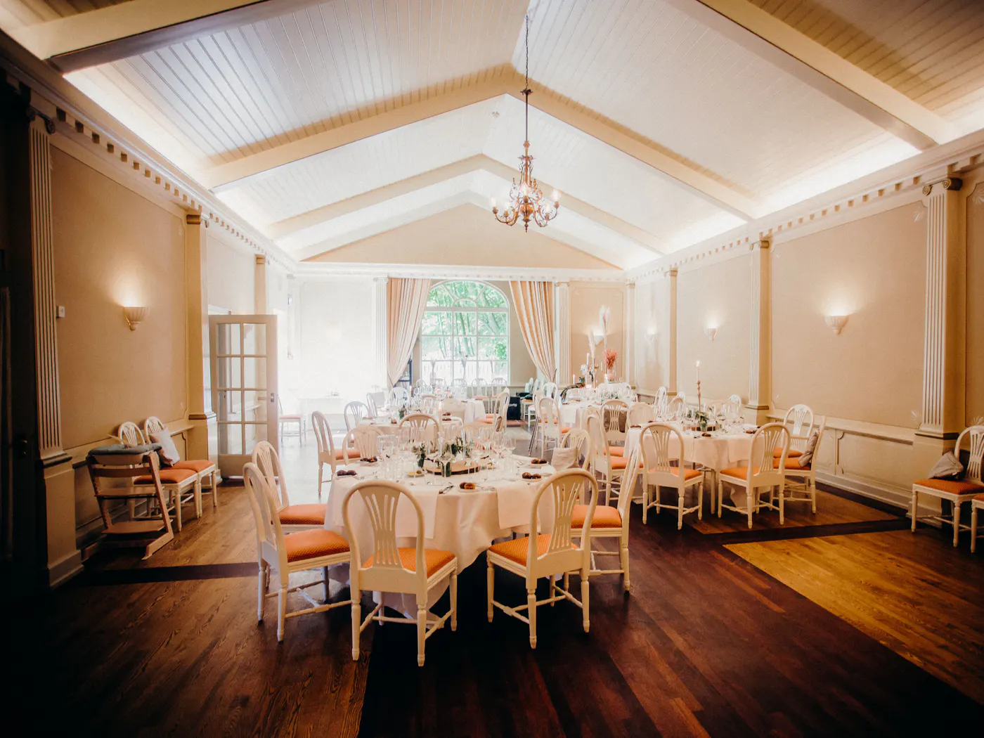 Dining tables arranged for a professional event.