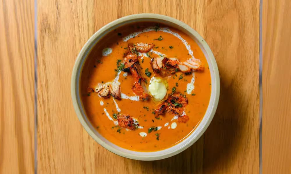 Butter Chicken served in a neutral ceramic bowl.