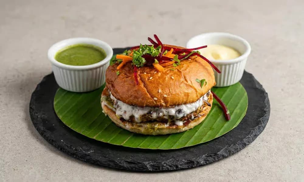 Chapli Smash Burger served with chutneys.