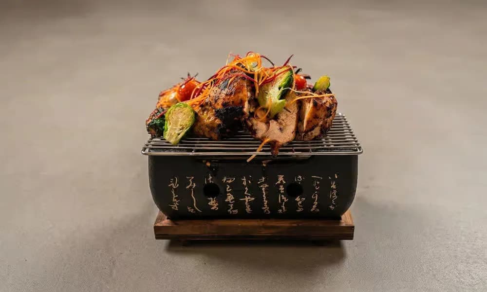 Tandoori Chicken served with onion, lemon, and green chutney.