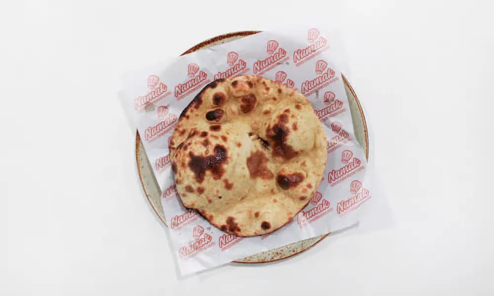 Tandoori Roti in a lined bread basket.