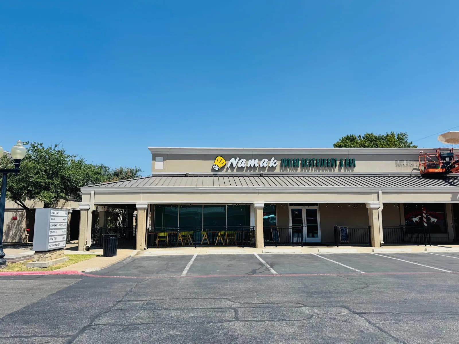 Namak storefront and entrance beneath a clear blue Dallas sky.